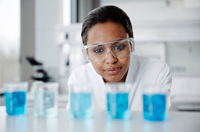 Doctor looking glass filled with liquid