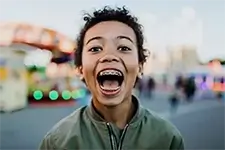 child showing off his braces