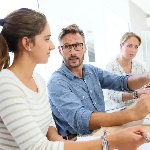 Group of people sitting in a meeting