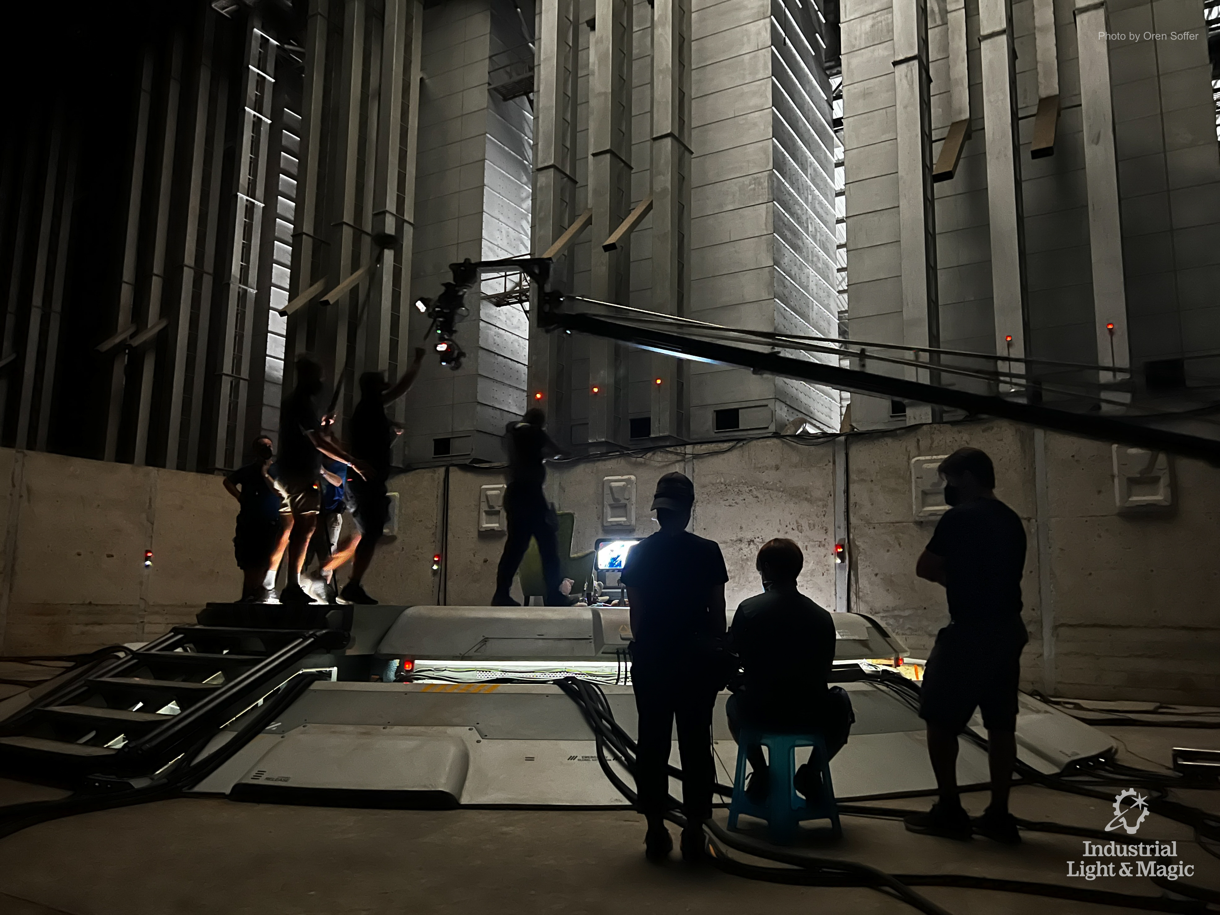 A film production crew working on an indoor set.