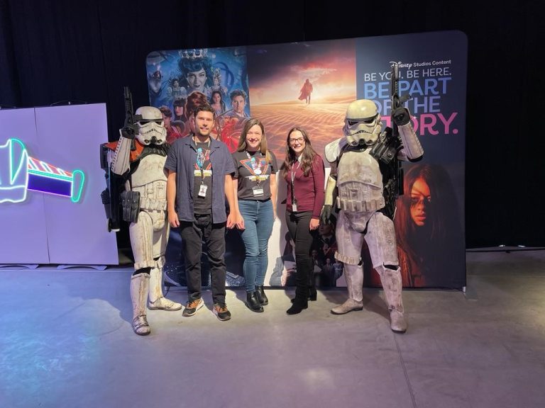 Disney employees posing with Stormtroopers