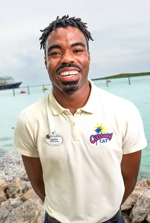 Keith at the beach, wearing his uniform and smiling