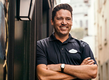 Employee - Man with arms crossed and smiling