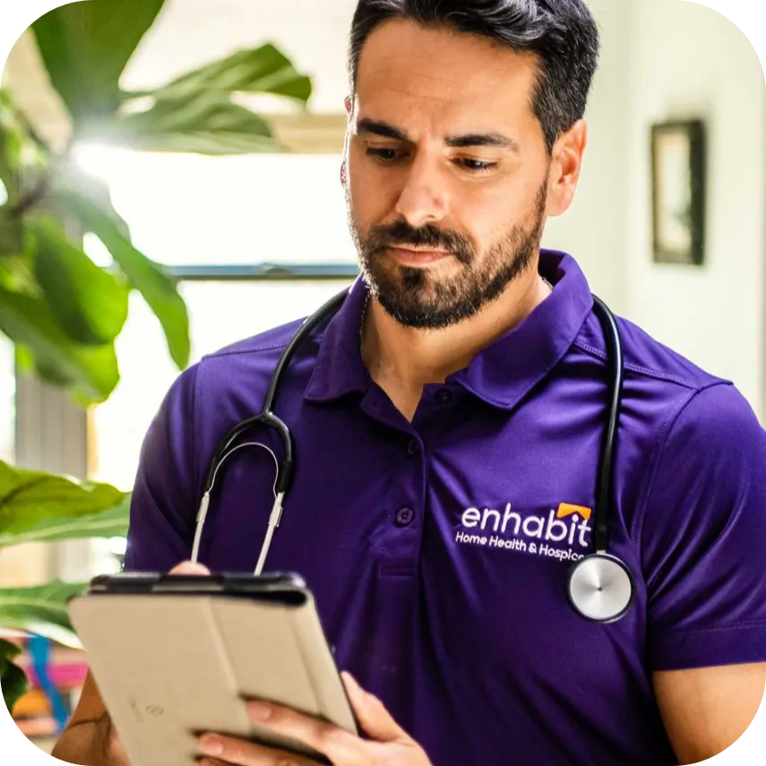 A nurse working on an ipad