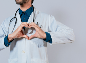 medical provider with hands in shape of heart