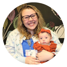 Nurse holding baby