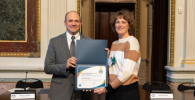 portrait of Laura Dailey with a certificate