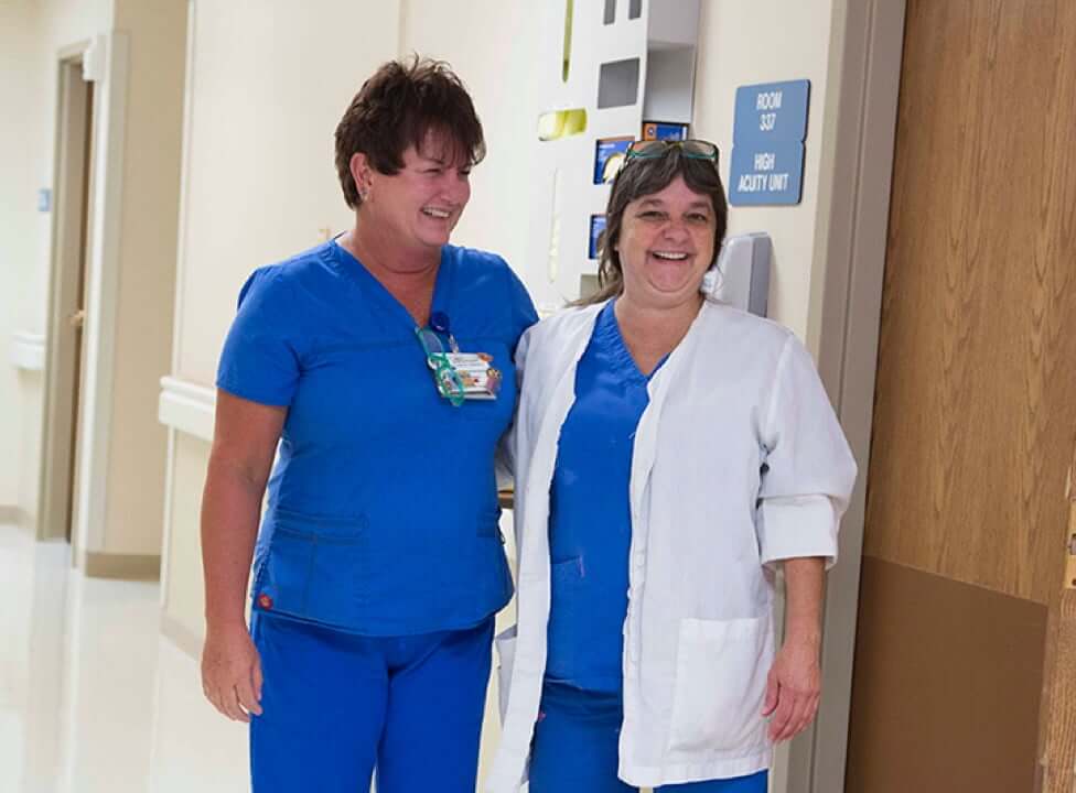 Two doctors standing in hallway