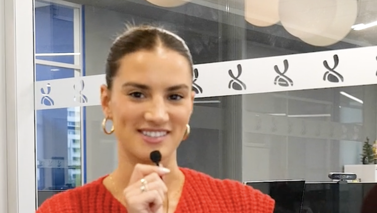 Female Intern Speaking into Microphone