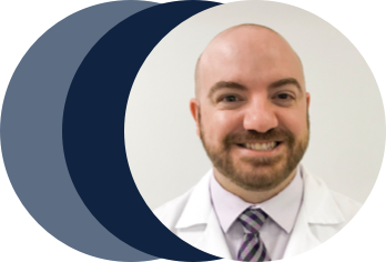 smiling male employee in a lab coat