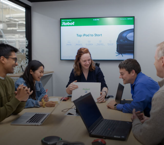 employees having a meeting in a conference room