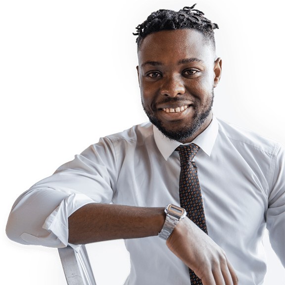 Man smiling while leaning on chair