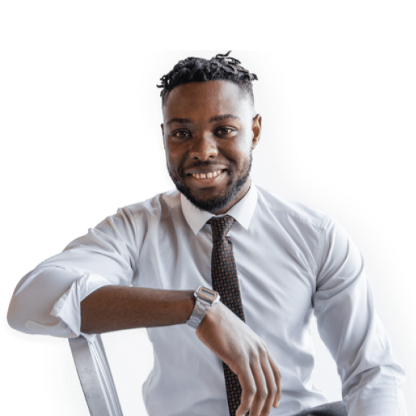 Man smiling while leaning on chair