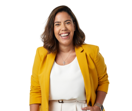 Woman in white top and gold blazer.