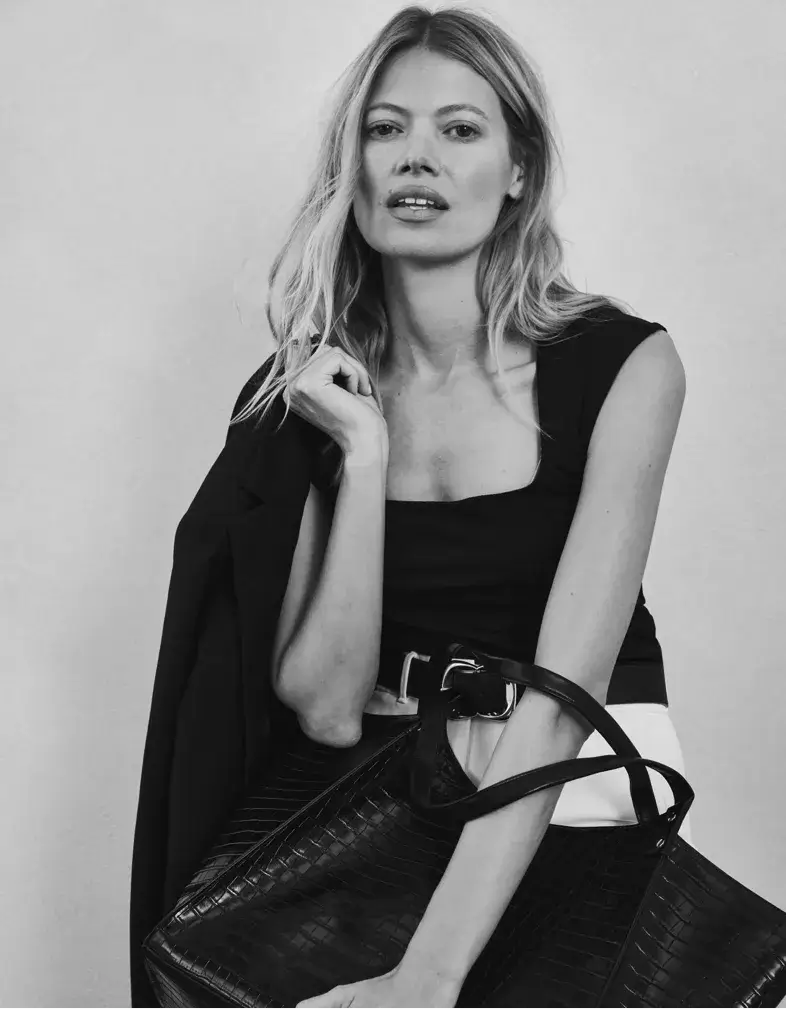 WHBM Model holding jacket and bag