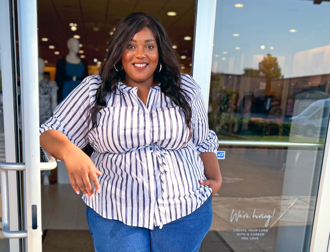 Manager of a Lane Bryant store opening the door.