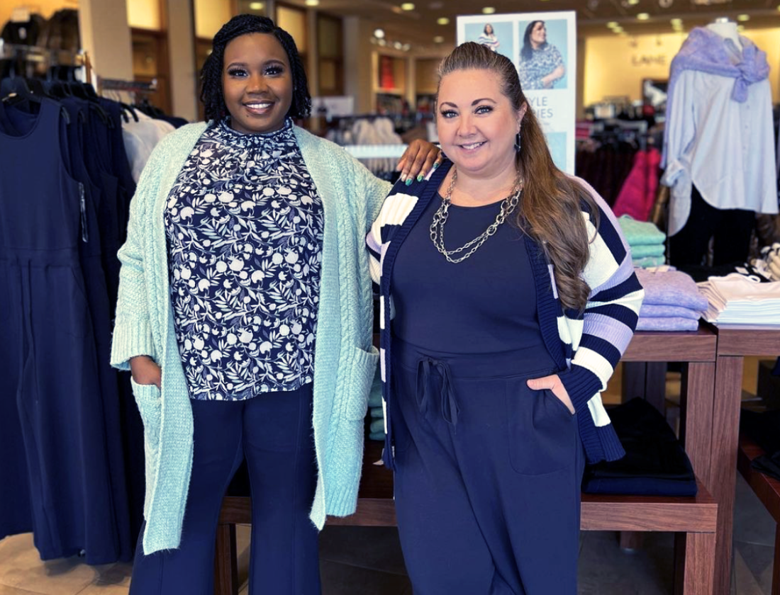 Two women standing together in a Lane Bryant store.