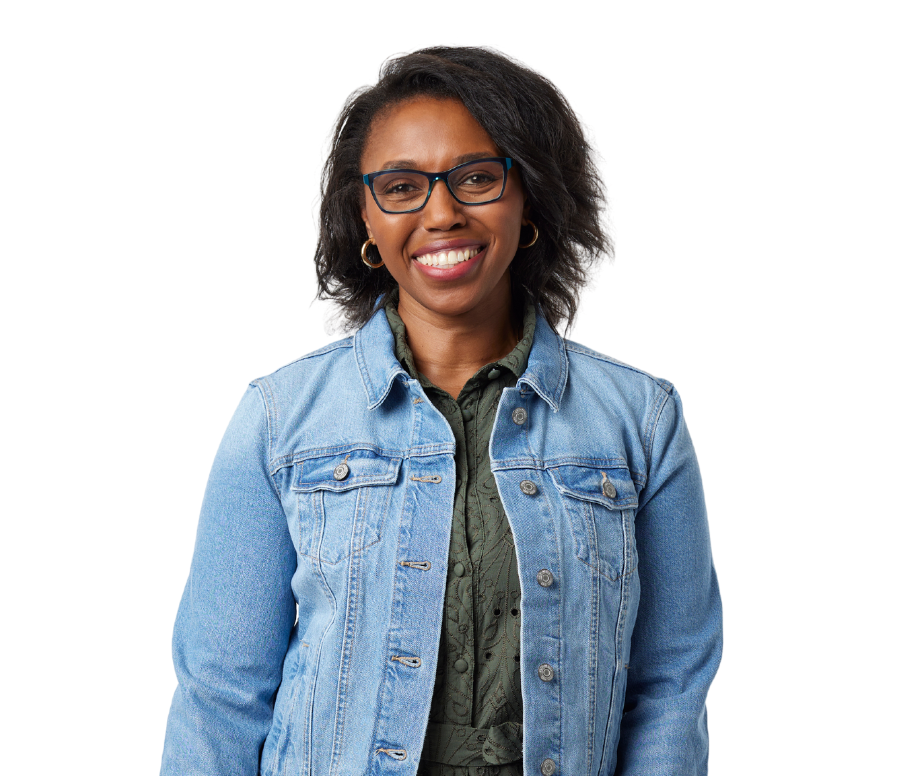 Woman in a green dress with jean jacket.