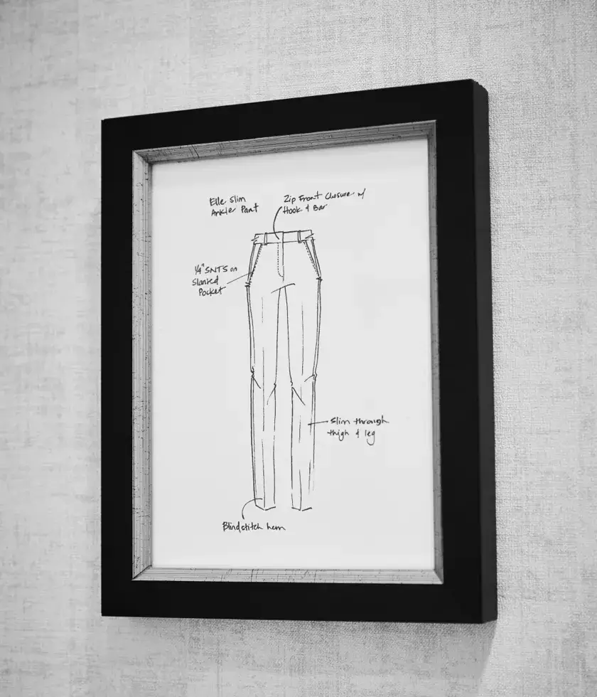 Fashion design concept sketch of pants framed on a wall