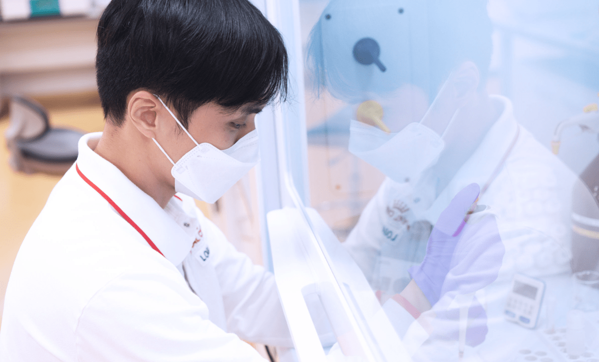 Employee working while wearing protective mask.