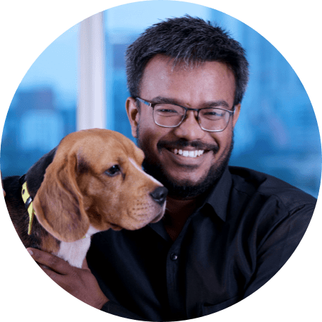 Man posing with a dog.