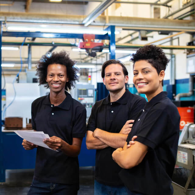 Three employees smiling