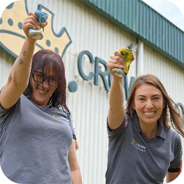 Two employees crushing cans