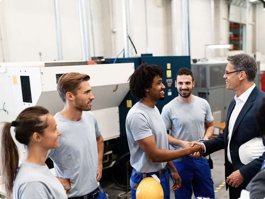 Two men walking in a factory