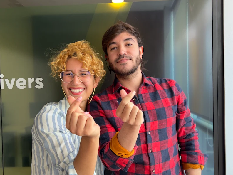 Two TTEC Colombia team members happily posing for a picture
