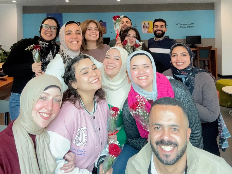 A team at TTEC Egypt happily posing for a photo.