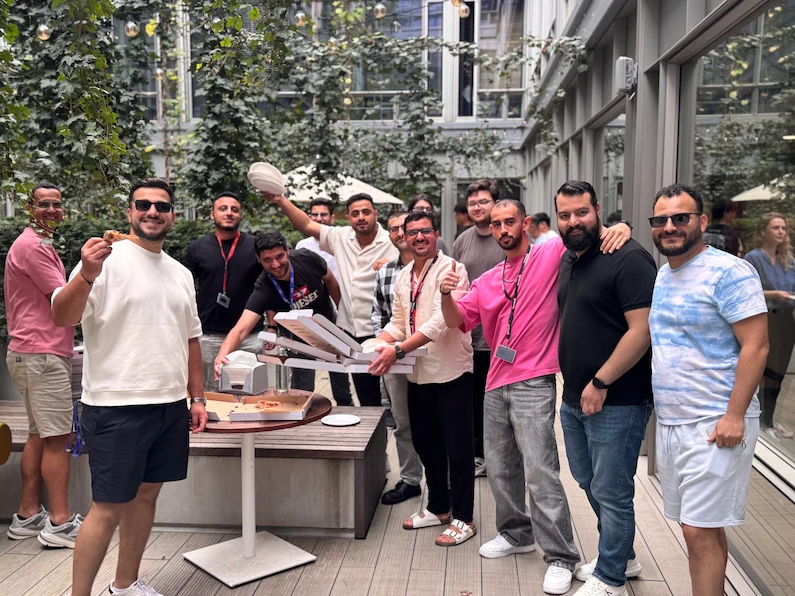 TTEC team in EMEA having a pizza party outside the office.