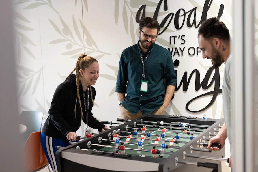 Employees enjoying the table football at TTEC Athens 