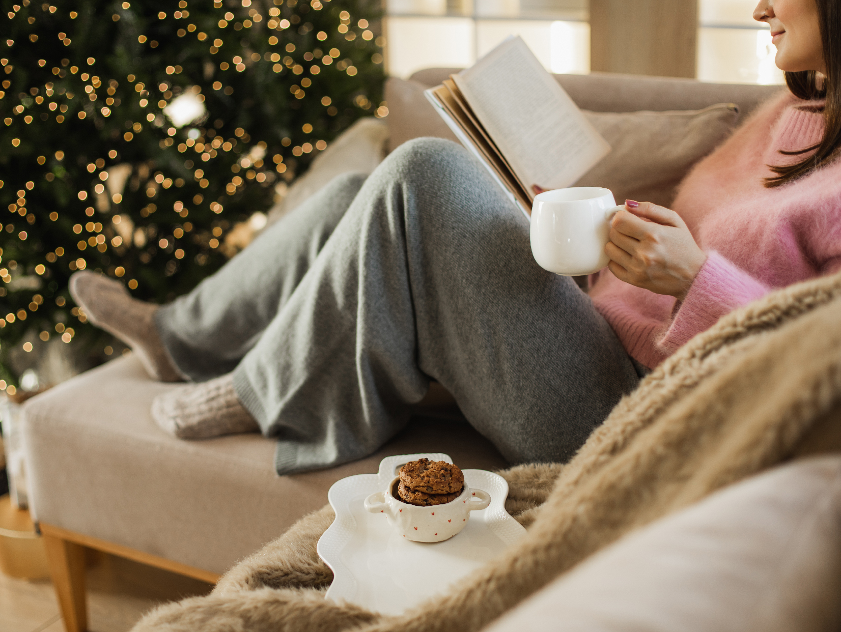 relaxing during holidays with hot chocolate and a book