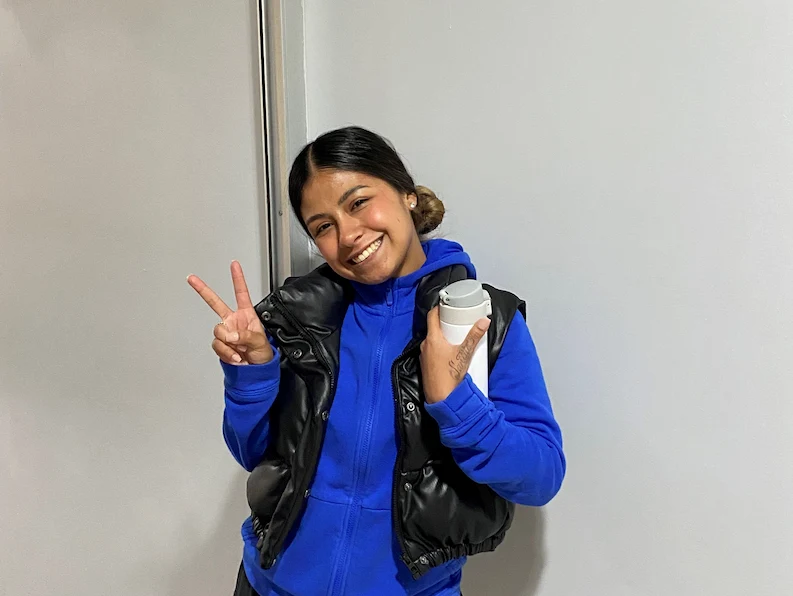 TTEC employee smiling and posing for a picture.