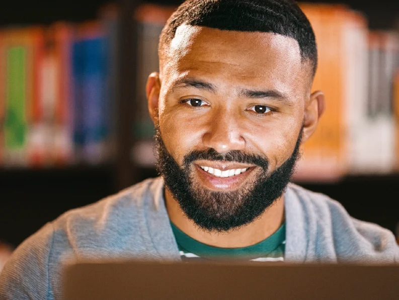 Man looking at laptop screen