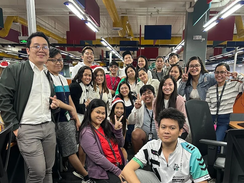 Team members of TTEC Philippines taking a group photo in the office.