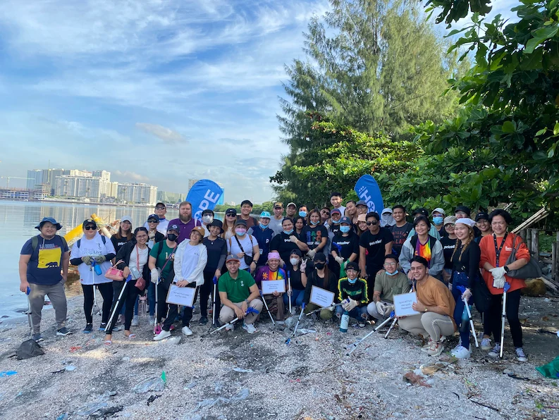 TTEC Philippines Team group picture during a coastal clean-up event.