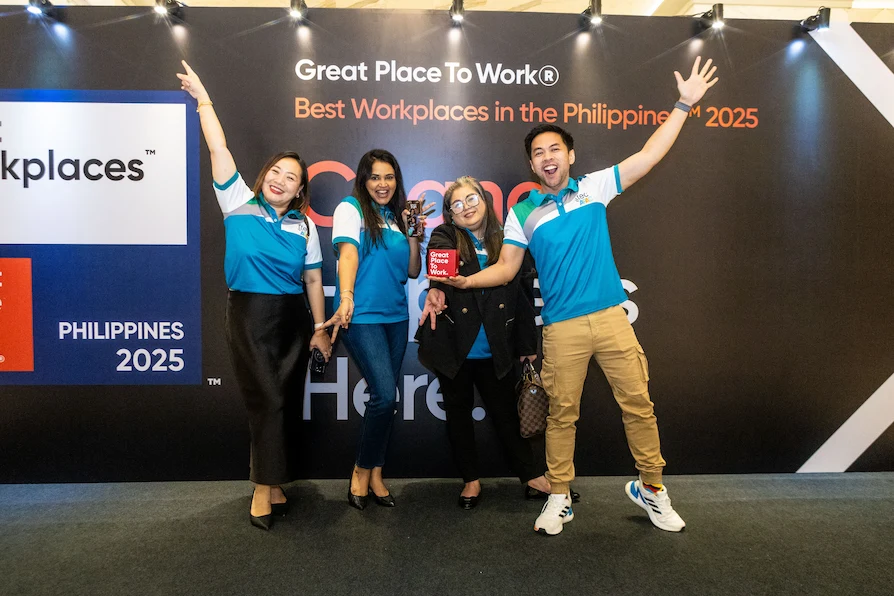 TTEC Philippines team members celebrating while holding the Great Place to Work 2025 award.