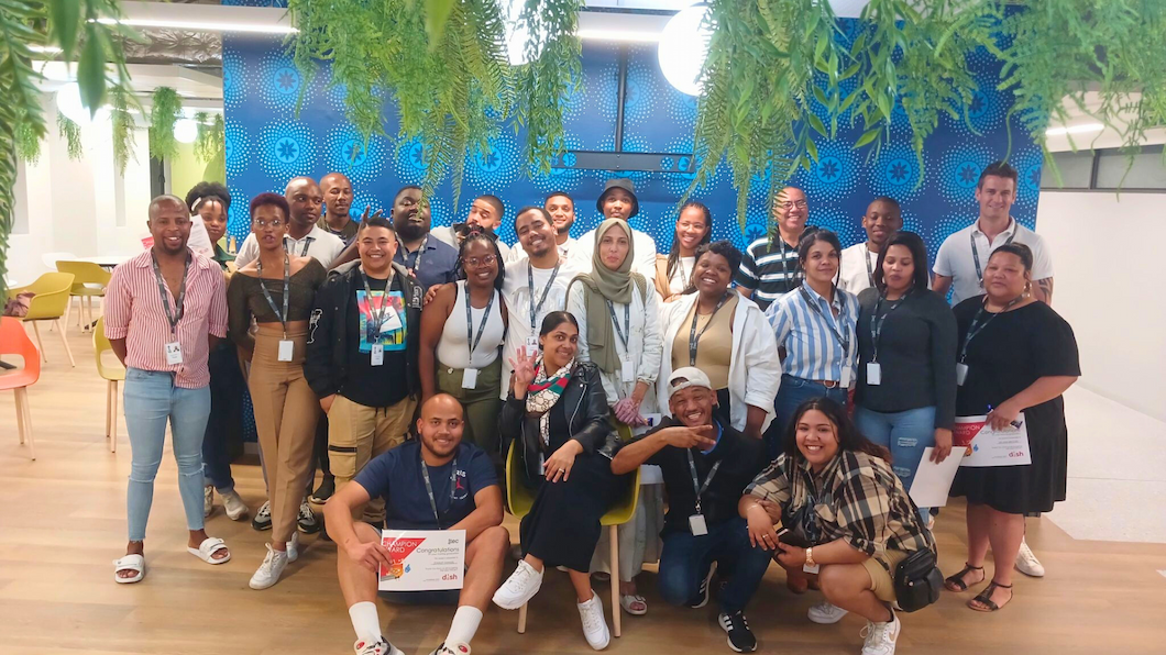 A team of diverse people working at TTEC