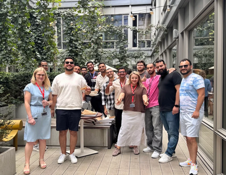 TTEC Poland team having a pizza party.