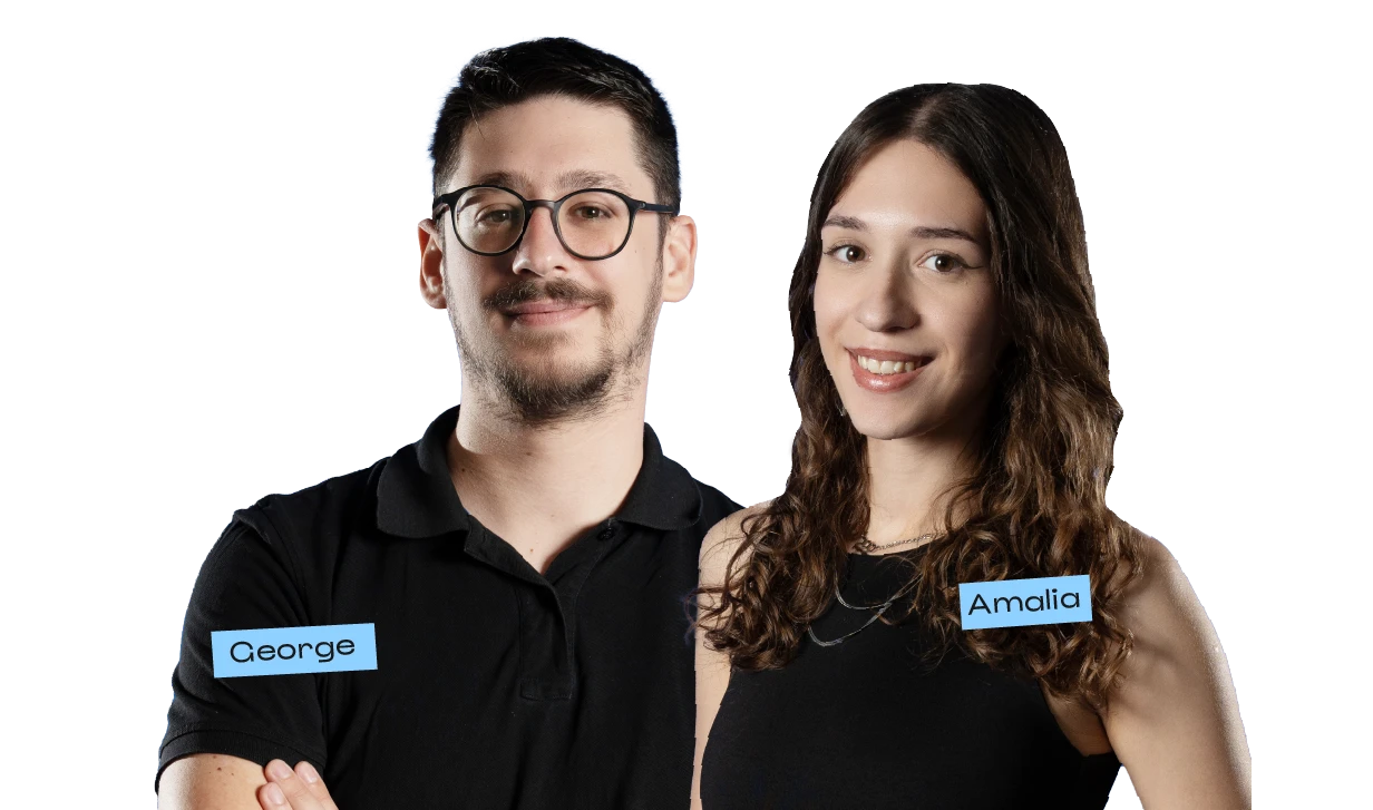 Two coworkers smiling at the camera