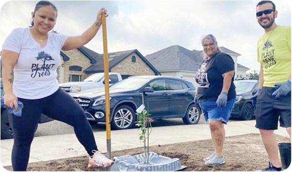 Group of TTEC employees planting a tree