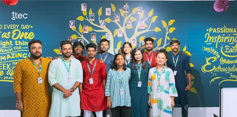 Six TTEC employees in traditional Indian clothing.