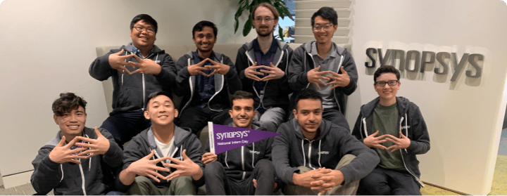 group of people with hand in the air