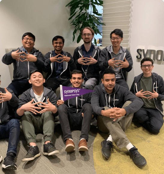 group of people with hand in the air