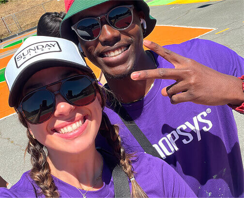 Man and woman posing for picture