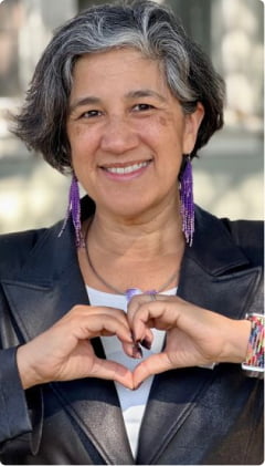 women making heart from hand