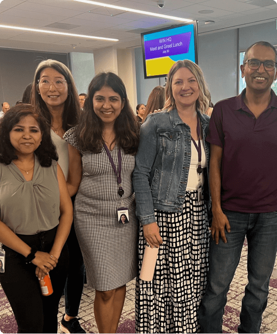 Synopsys employees posing for a picture at the Grace Hopper Conference