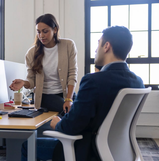 Woman and Man on the technology team collaborating