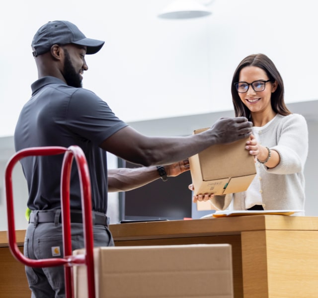 man delivering package to woman